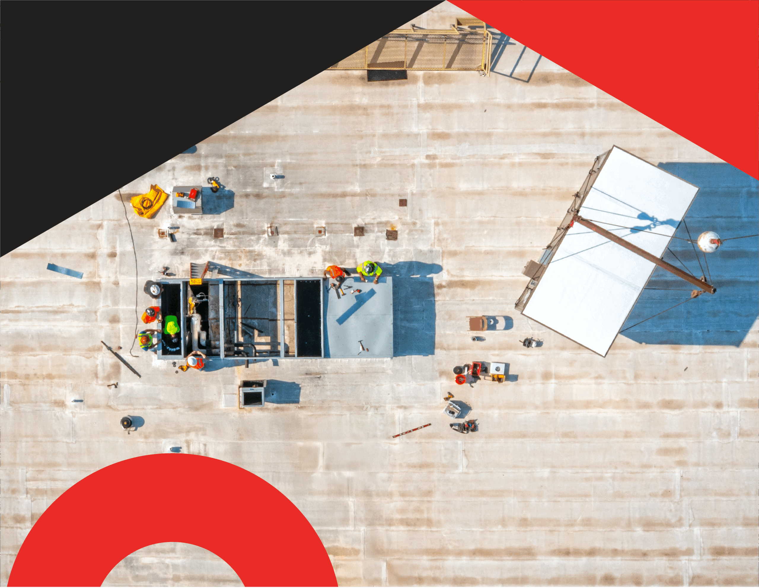 Aerial view of a commercial HVAC replacement project showing rooftop technicians and crane equipment, highlighting system efficiency and total cost of ownership improvements through modern BAS integration.